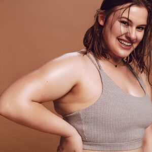 Woman with Hyperhidrosis smiling while sweating