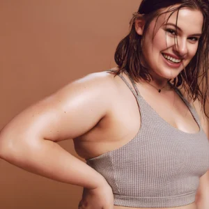 Woman with Hyperhidrosis smiling while sweating