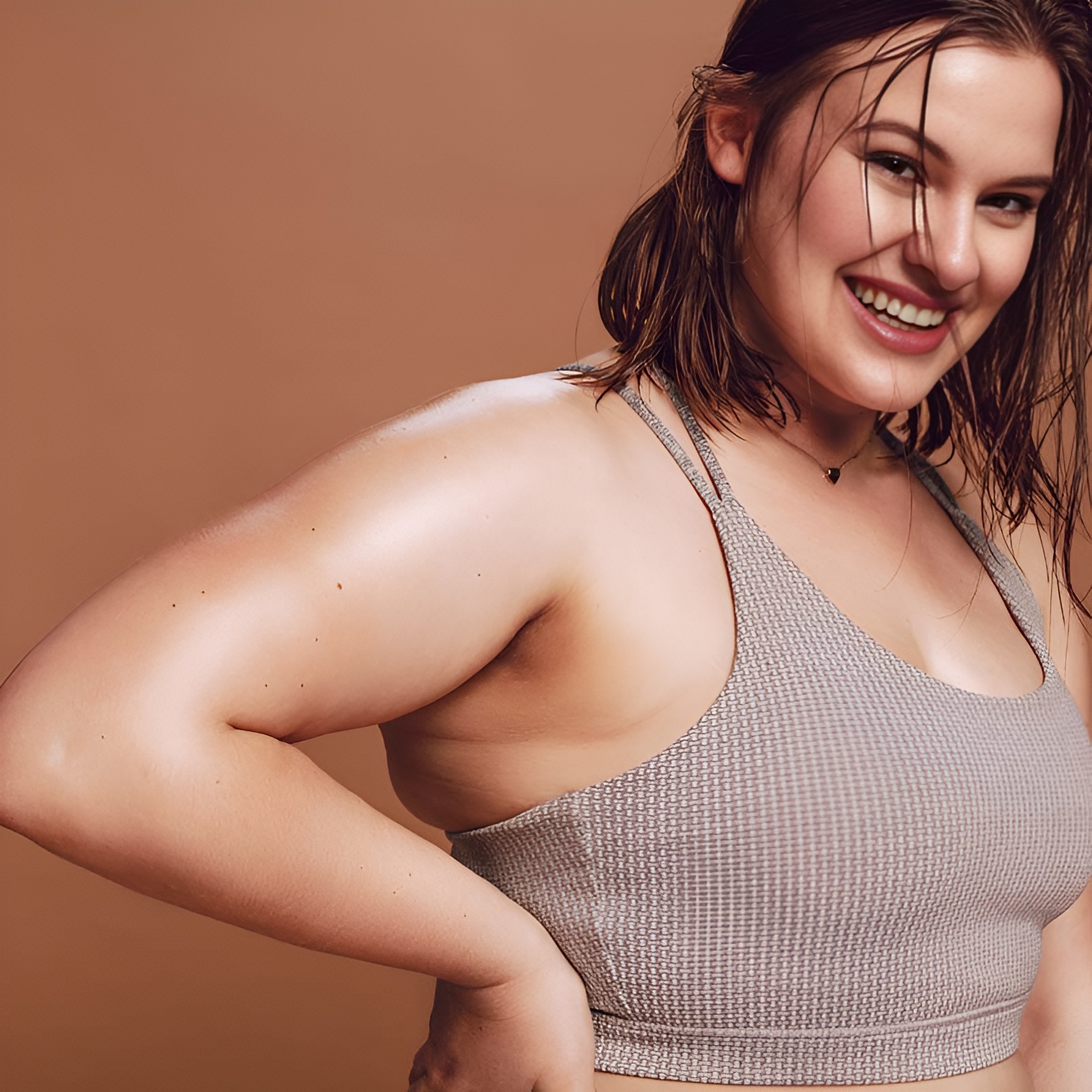 Woman with Hyperhidrosis smiling while sweating