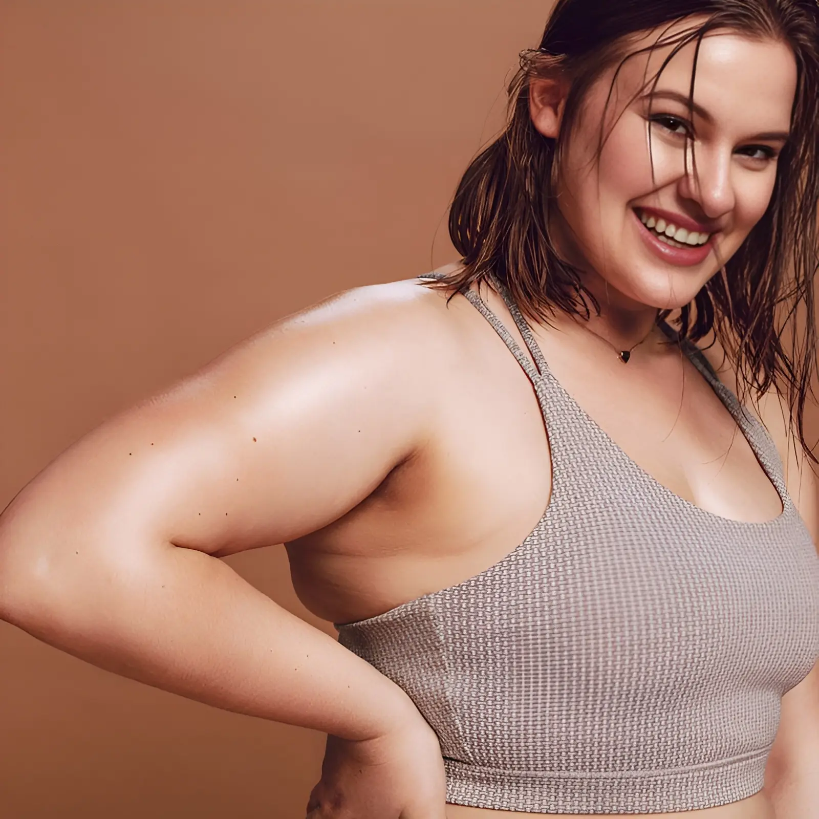 Woman with Hyperhidrosis smiling while sweating
